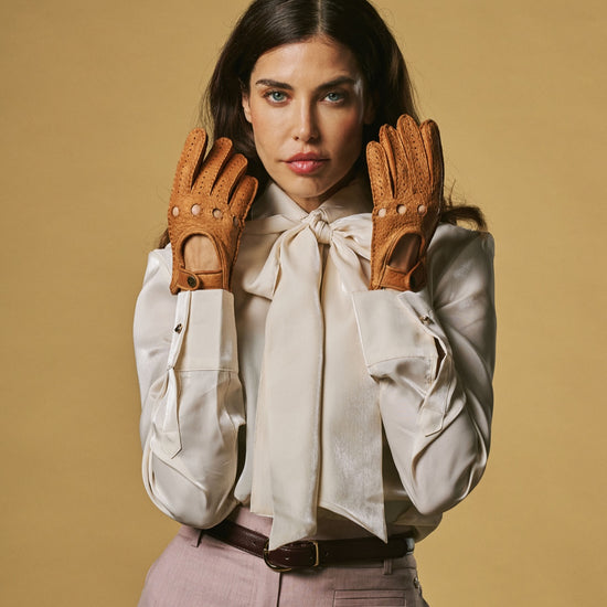 Women’s cognac leather driving gloves, perforated knuckles and buttoned wrist straps