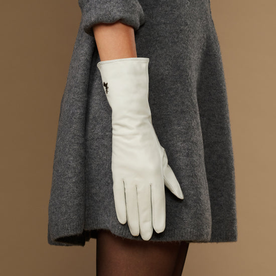 White long leather gloves, full hand view with subtle logo on cuff