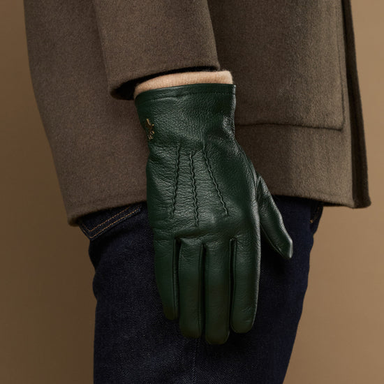 Men's dark green leather glove with wool lining at the wrist cuff