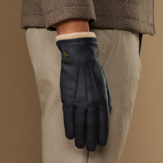 Men's navy leather gloves with wool lining, cuff showing soft inner knit