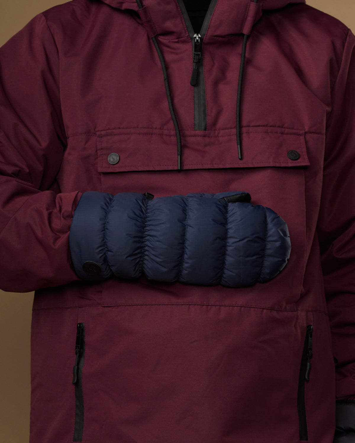 Blue padded mitten with stretchy cuff and snap-button wrist closure