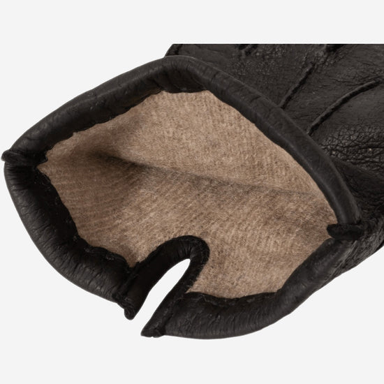 Women's black leather gloves with cashmere lining visible at open cuff