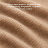 Cream cashmere lining inside a cognac leather glove cuff