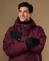 Black activity gloves worn crossed over the chest, showing their smooth backs
