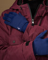 Blue activity gloves with smooth backs and small white logo