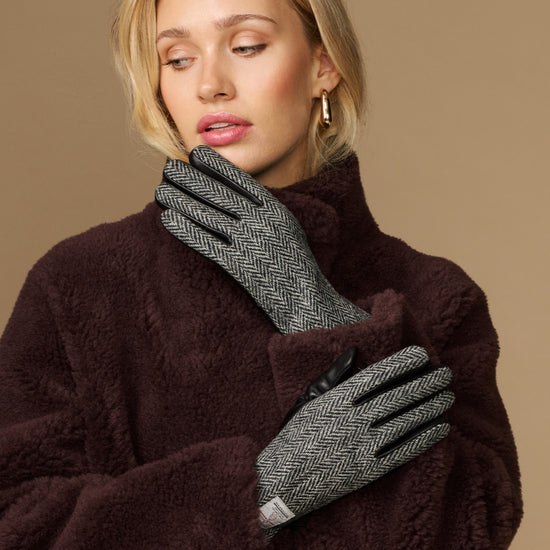 Women's herringbone tweed gloves with black fingertips and dark cuff
