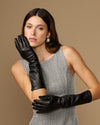 Black below-elbow leather gloves with touchscreen fingertips, glossy finish, ruched cuff