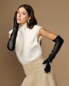 Black lambskin leather opera gloves with silk lining, long cuffs in hand pose