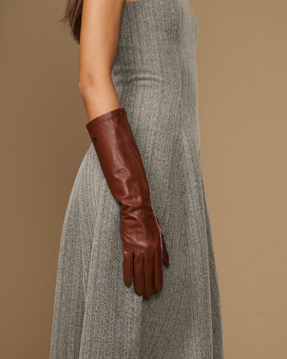 Cognac leather below-elbow gloves, long fitted cuffs and tapered fingers
