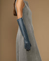 Dark blue elbow-length leather glove, side view with long cuff