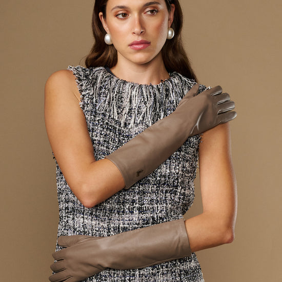Taupe lambskin leather gloves, below-elbow style with stitched finger detail and neat cuff.