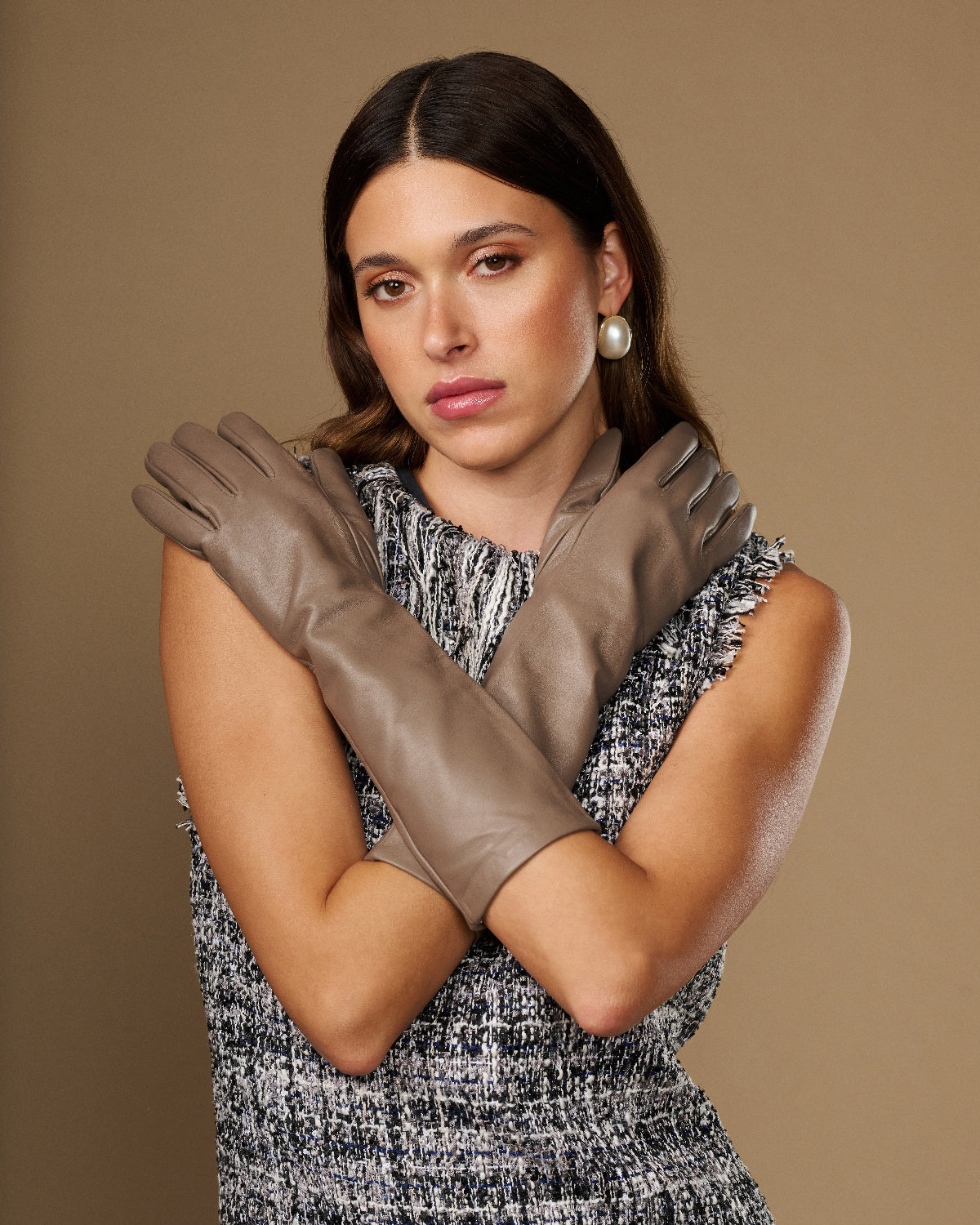 Taupe lambskin leather gloves, below-elbow fit, tapered fingers and slim cuff detail.