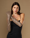 Taupe lambskin elbow-length leather gloves on model, crossed arms