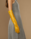 Yellow leather elbow gloves with long cuffs and tapered fingers