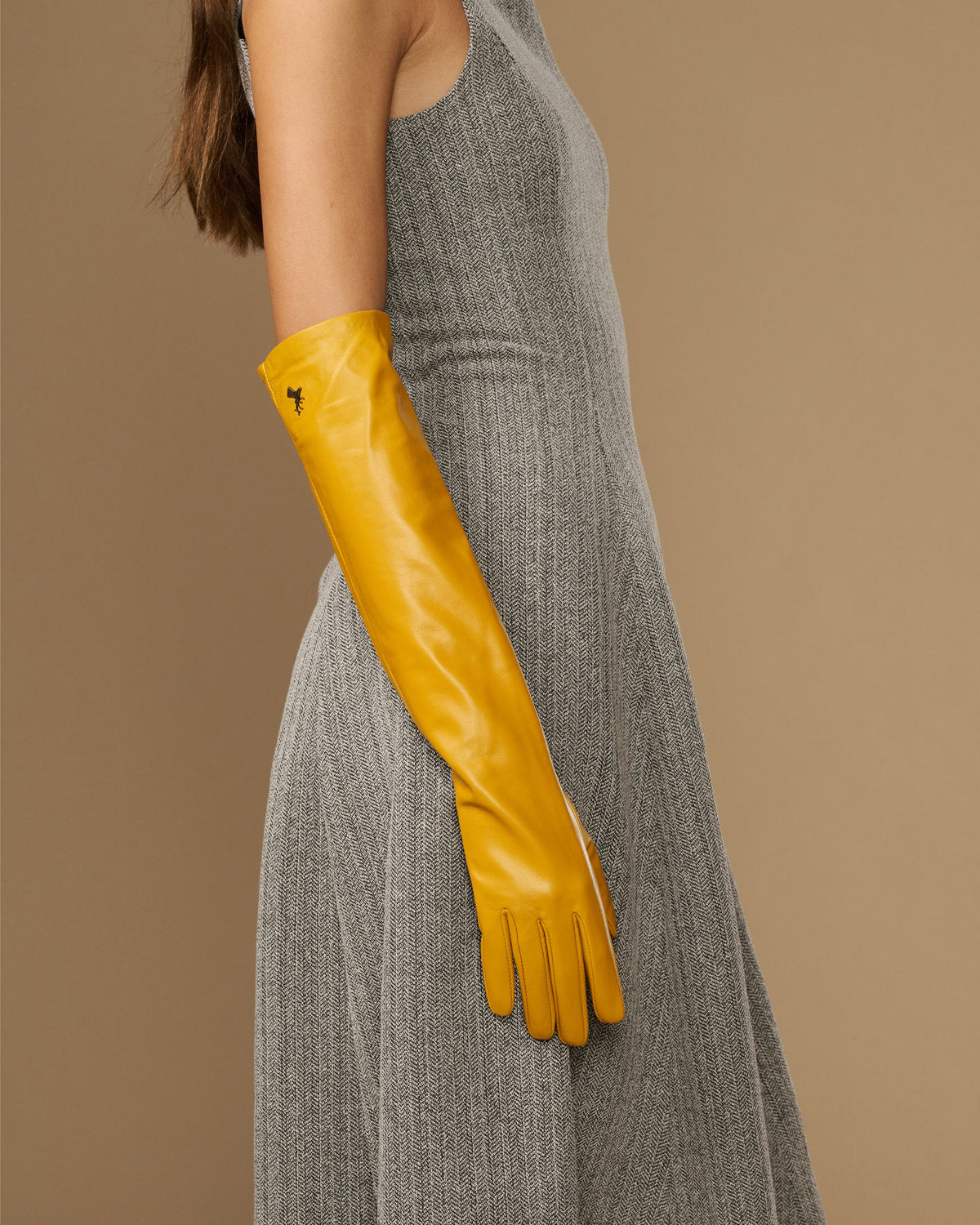 Yellow leather elbow gloves with long cuffs and tapered fingers